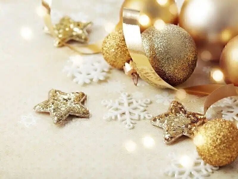 Glitter gold orb and star ornaments with snowflakes
